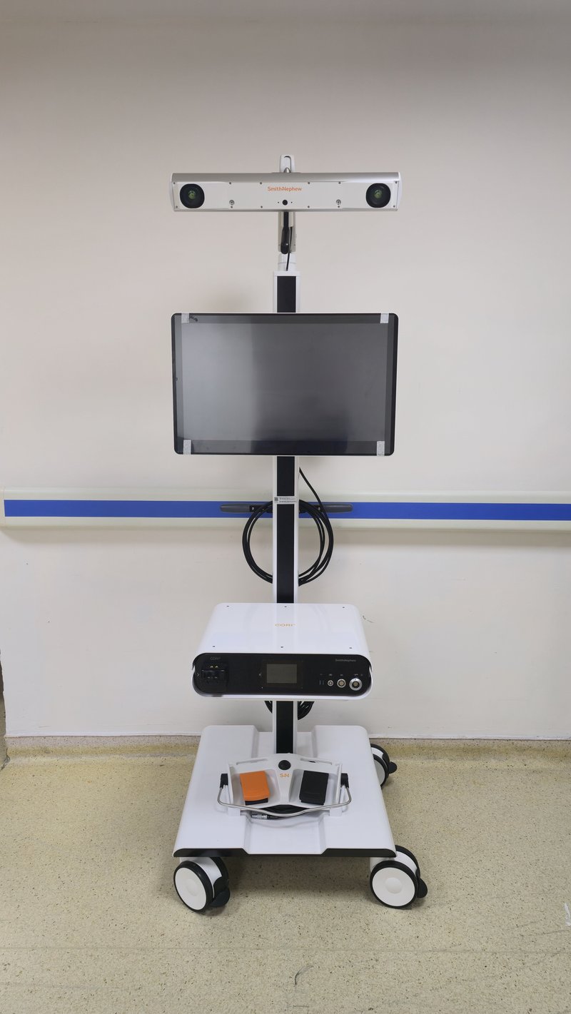 Smith & Nephew CORI Real Intelligence robotic surgical system on its mobile cart